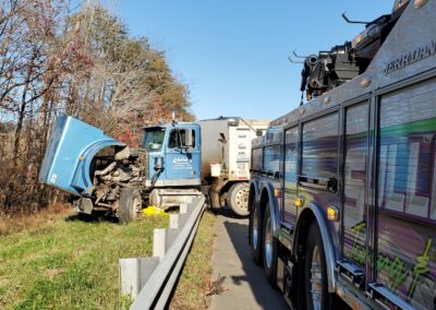 Sullivan's Towing & Recovery, LLC recovering a truck from the highway