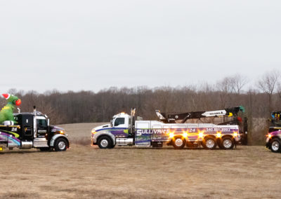 Sullivan's Towing & Recovery, LLC trucks decorated with holiday decorations