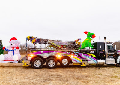 Sullivan's Towing & Recovery, LLC trucks with holiday decorations