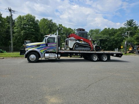 Sullivan's Towing & Recovery truck transporting holiday decorations